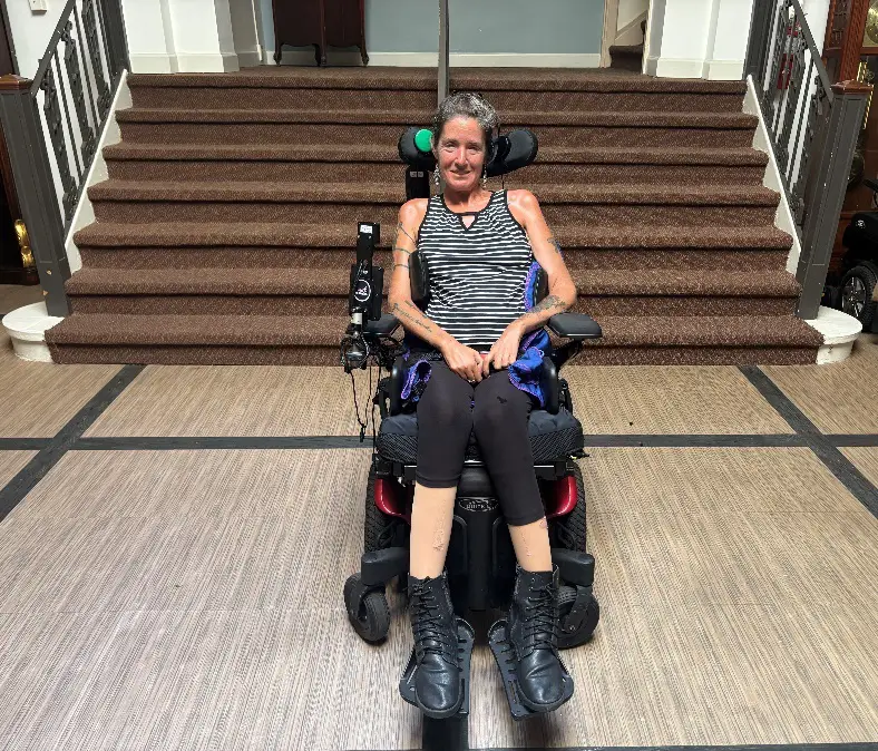 Jean in her power wheelchair