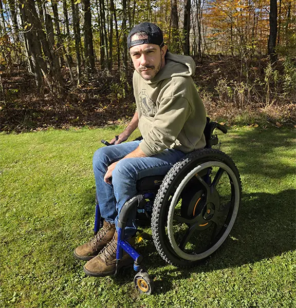 Zac in his Quickie Nitrum wheelchair with Empulse M90 power assist wheels